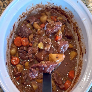 Crockpot steak bites with potatoes, carrots, celery, and rich broth