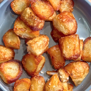 Oven roasted potatoes cooked in duck fat and seasoned with rosemary salt