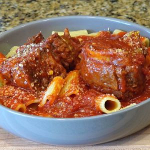 Pasta topped with Sunday red sauce and tender braised short ribs