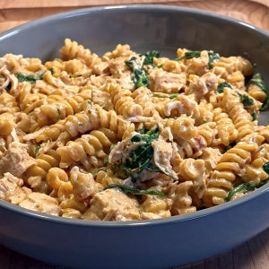 Slow cooker creamy Tuscan chicken pasta with sun dried tomatoes and spinach