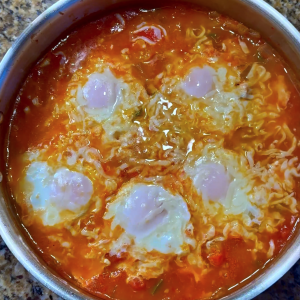 Mediterranean tomato egg skillet with peppers and melted cheese